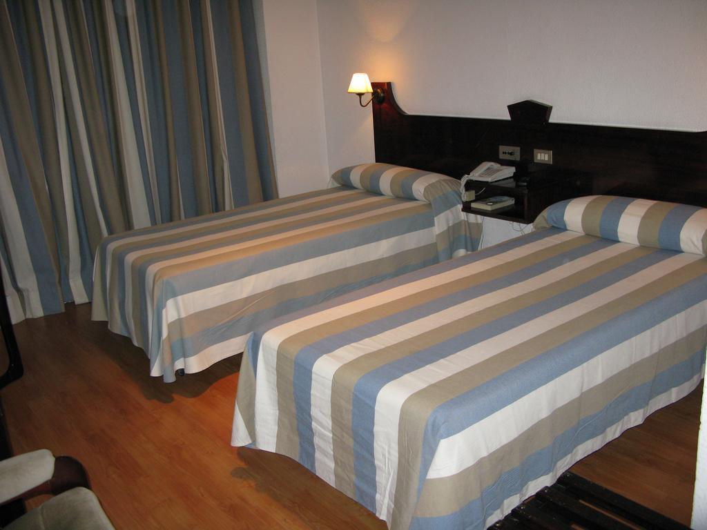 Hotel Lisboa Badajós Quarto foto